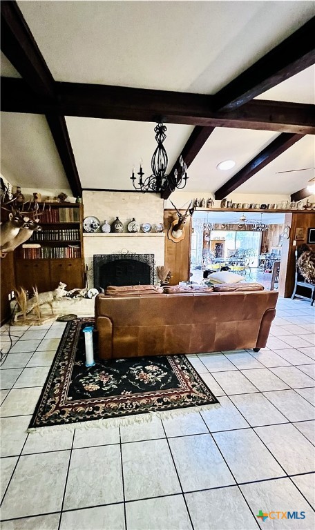 living room featuring light tile patterned flooring and beam ceiling