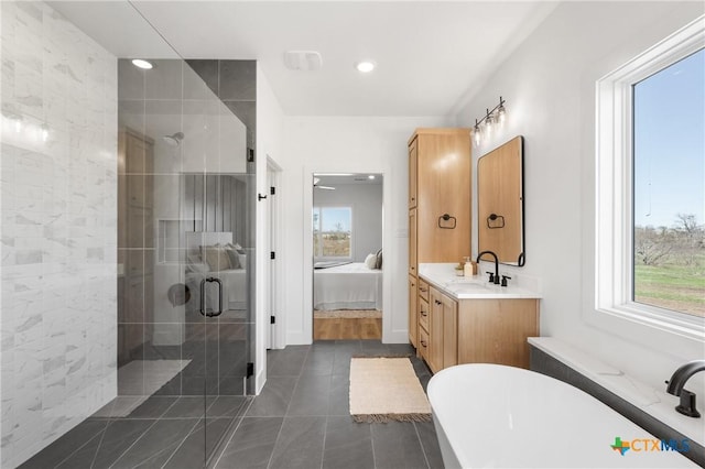 bathroom featuring shower with separate bathtub, vanity, tile patterned floors, and plenty of natural light