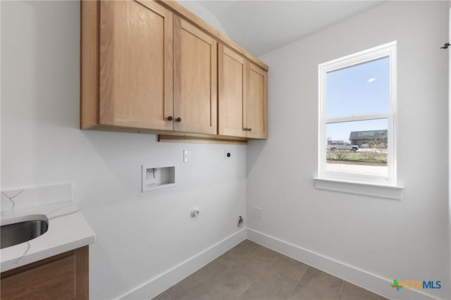 clothes washing area with cabinets, hookup for a washing machine, hookup for an electric dryer, sink, and hookup for a gas dryer