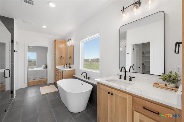 bathroom featuring vanity, tile patterned floors, and independent shower and bath