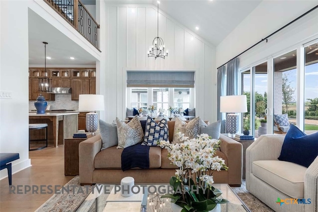 2958 Mckinnie Park, Bulverde, TX 78163 - living room with high vaulted ceiling, plenty of natural light, a chandelier, light wood finished floors, and recessed lighting