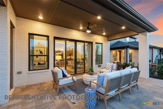 2958 Mckinnie Park, Bulverde, TX 78163 - patio terrace at dusk featuring an outdoor hangout area, a patio area, and ceiling fan