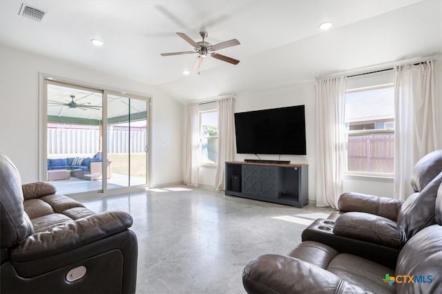 living room featuring ceiling fan and vaulted ceiling