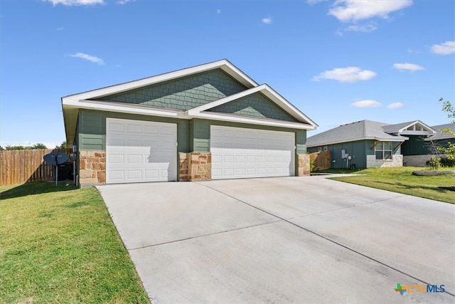 view of front facade with a garage and a front yard