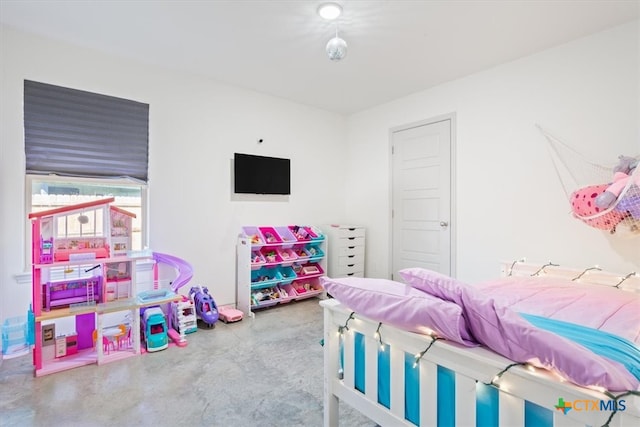 bedroom featuring concrete flooring