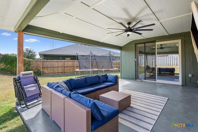 view of patio featuring an outdoor living space, ceiling fan, and a trampoline