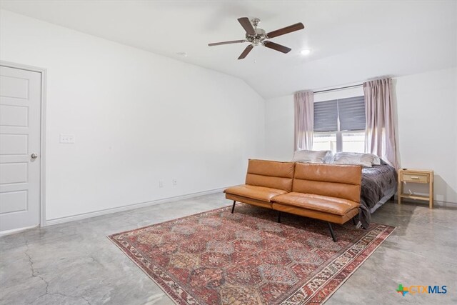 bedroom with concrete floors, vaulted ceiling, and ceiling fan