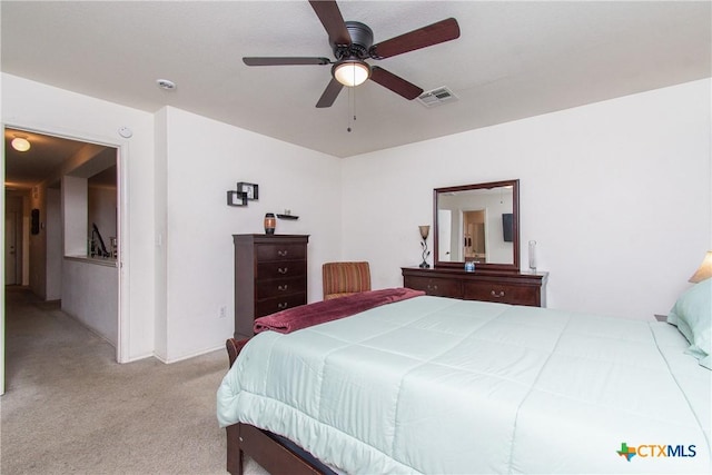 bedroom featuring light colored carpet and ceiling fan