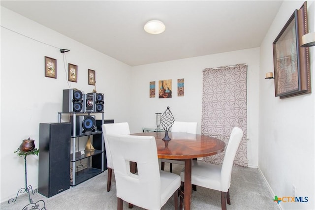 dining space featuring carpet floors