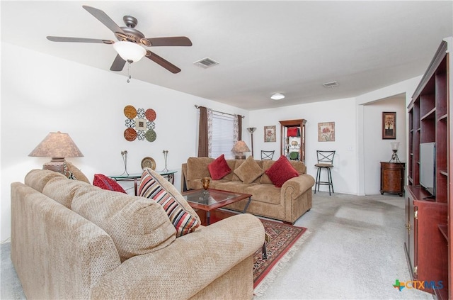 living room with ceiling fan and light carpet