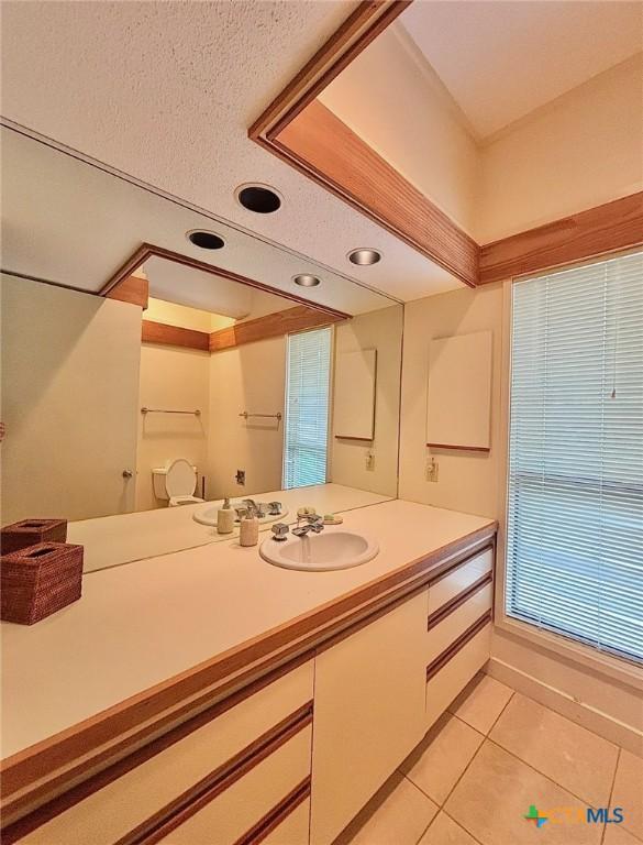 bathroom with recessed lighting, tile patterned floors, toilet, and vanity