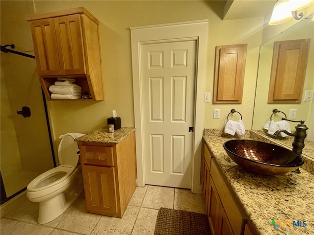 bathroom featuring vanity, toilet, and an enclosed shower