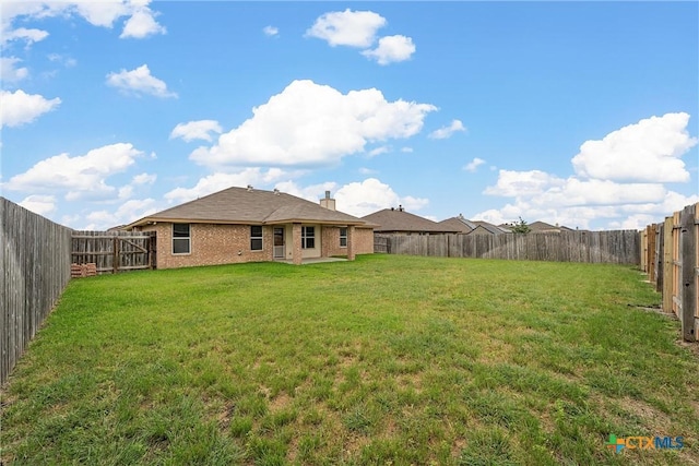 308 Constellation Dr, Killeen, TX 76542 - rear view of house featuring brick siding and a chimney