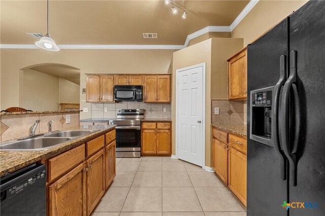 308 Constellation Dr, Killeen, TX 76542 - kitchen with black appliances, a sink, crown molding, arched walkways, and backsplash