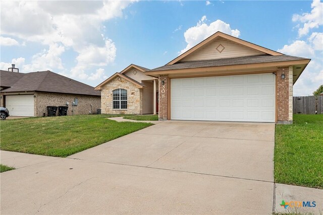 308 Constellation Dr, Killeen, TX 76542 - ranch-style house featuring driveway, brick siding, and a garage