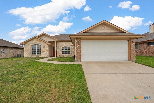 308 Constellation Dr, Killeen, TX 76542 - view of front of home with cooling unit, driveway, a front yard, and a garage