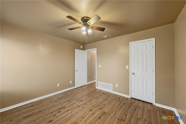308 Constellation Dr, Killeen, TX 76542 - unfurnished bedroom featuring wood finished floors, baseboards, and a ceiling fan