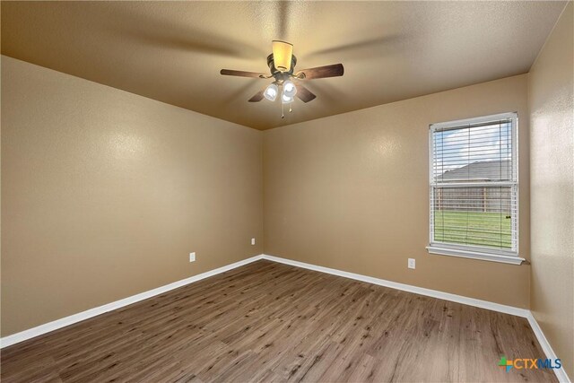 308 Constellation Dr, Killeen, TX 76542 - empty room with wood finished floors, baseboards, and a ceiling fan