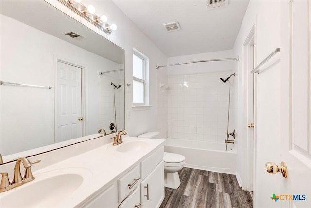 5500 Lions Gate Ln, Killeen, TX 76549 - bathroom with double vanity, shower / washtub combination, and wood finished floors
