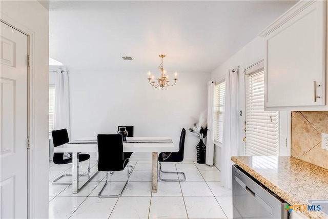 5500 Lions Gate Ln, Killeen, TX 76549 - dining area featuring a chandelier and baseboards