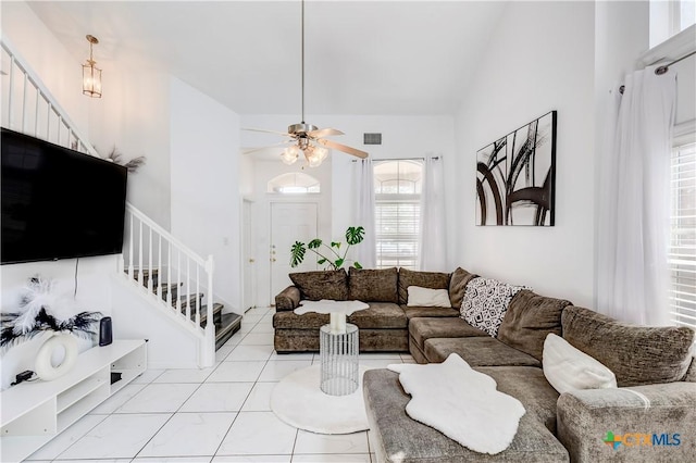 5500 Lions Gate Ln, Killeen, TX 76549 - living area featuring stairway, light tile patterned floors, a ceiling fan, and lofted ceiling