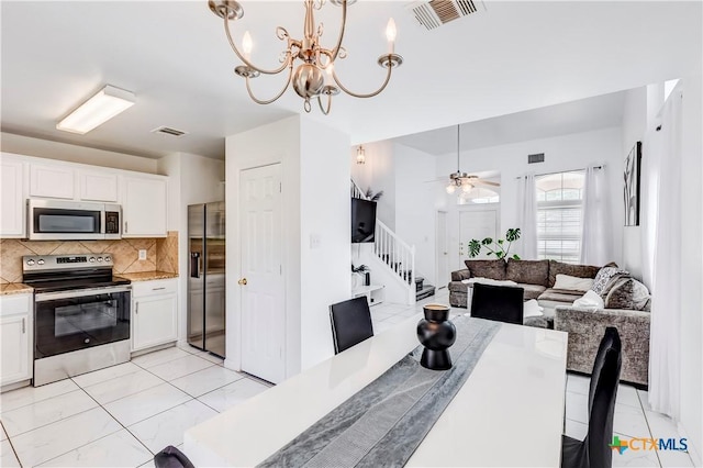 5500 Lions Gate Ln, Killeen, TX 76549 - dining area with stairway, a chandelier, and ceiling fan