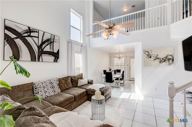5500 Lions Gate Ln, Killeen, TX 76549 - living room with plenty of natural light, a towering ceiling, a ceiling fan, and a chandelier