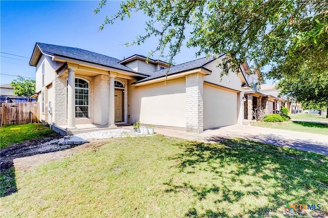 5500 Lions Gate Ln, Killeen, TX 76549 - view of front facade with an attached garage, driveway, stucco siding, and brick siding