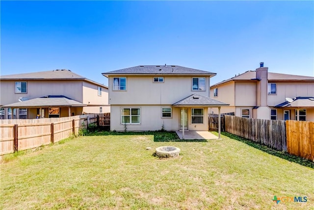 5500 Lions Gate Ln, Killeen, TX 76549 - rear view of house featuring a fenced backyard, a patio, and a fire pit