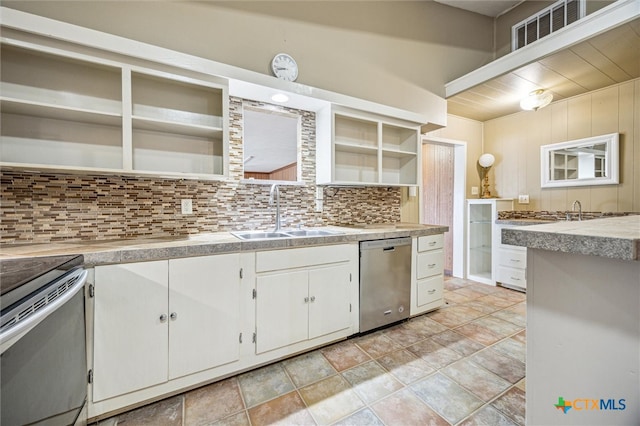 kitchen with open shelves, a sink, tasteful backsplash, appliances with stainless steel finishes, and white cabinets