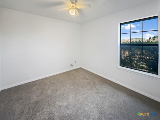 carpeted empty room with ceiling fan