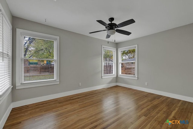 163 S Mesquite Ave, New Braunfels, TX 78130 - empty room with plenty of natural light, wood finished floors, and a ceiling fan