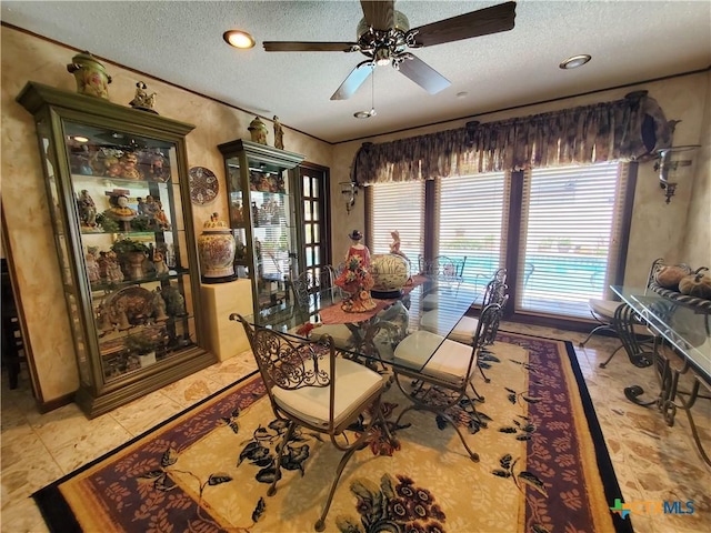 313 N Church, Goliad, TX 77963 - dining area with a textured ceiling and ceiling fan