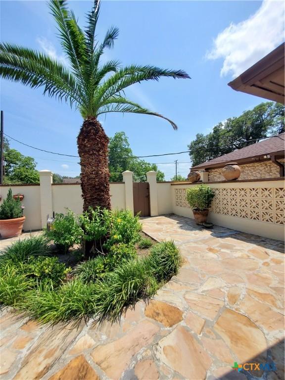 313 N Church, Goliad, TX 77963 - view of patio / terrace with a gate