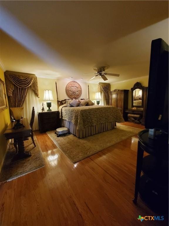 313 N Church, Goliad, TX 77963 - bedroom featuring wood finished floors and a ceiling fan