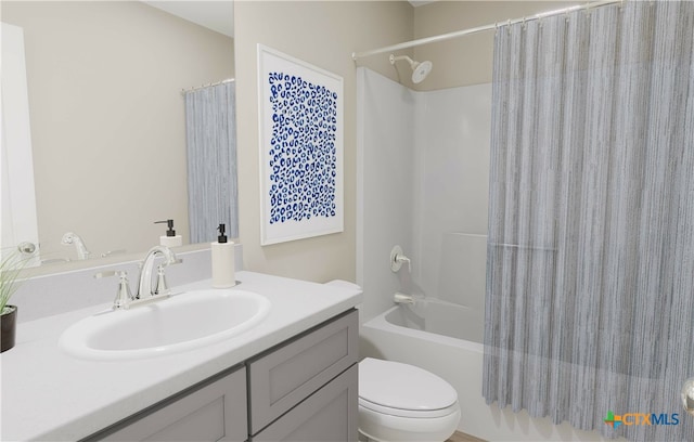 full bathroom with vanity, toilet, and shower / bath combo with shower curtain