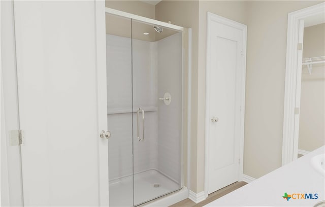 bathroom with vanity and walk in shower