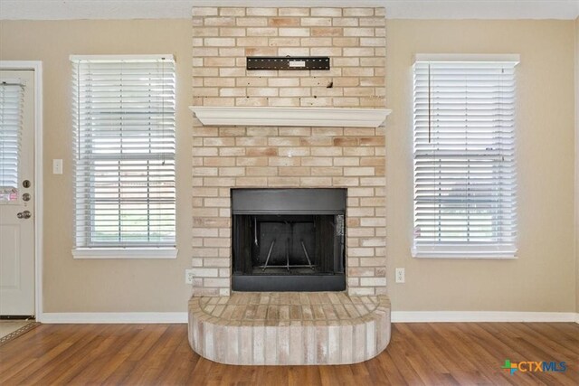 4103 Barrington Trl, Killeen, TX 76549 - detailed view of wood finished floors and a fireplace