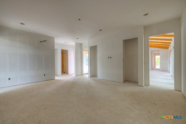 spare room featuring vaulted ceiling