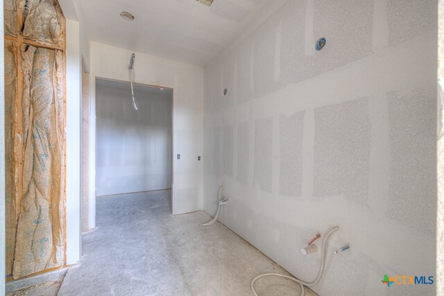 bathroom featuring concrete flooring