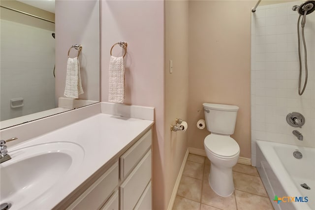 full bathroom with tile patterned flooring, vanity, toilet, and tiled shower / bath