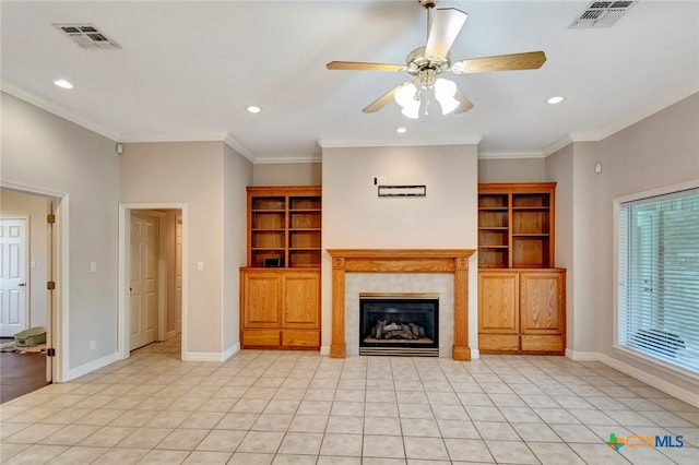 unfurnished living room with a tile fireplace, ceiling fan, crown molding, and light tile patterned flooring