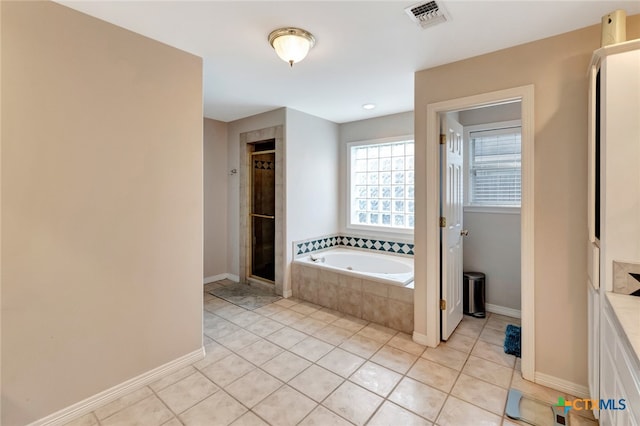 bathroom featuring shower with separate bathtub and tile patterned floors