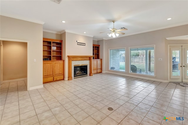 unfurnished living room featuring ceiling fan, built in features, a fireplace, light tile patterned flooring, and ornamental molding