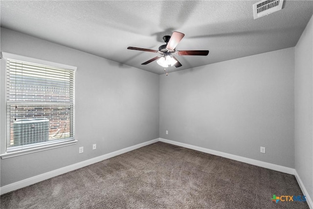 3305 Crystal Ann Dr, Temple, TX 76502 - empty room with a ceiling fan, healthy amount of natural light, carpet flooring, and a textured ceiling
