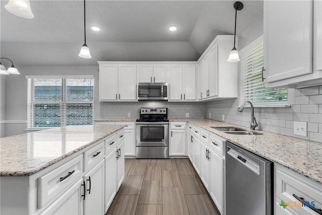 3305 Crystal Ann Dr, Temple, TX 76502 - kitchen featuring appliances with stainless steel finishes, white cabinetry, healthy amount of natural light, and recessed lighting