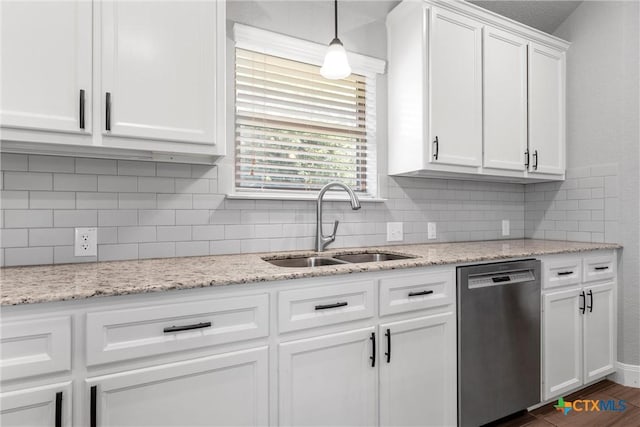 3305 Crystal Ann Dr, Temple, TX 76502 - kitchen with stainless steel dishwasher, white cabinets, backsplash, and dark wood-style floors