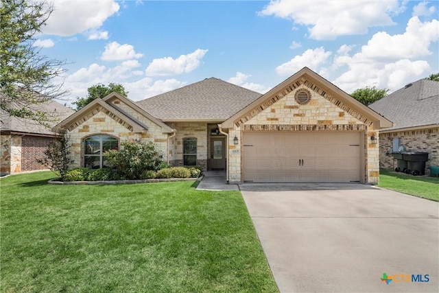 3305 Crystal Ann Dr, Temple, TX 76502 - french provincial home with stone siding, a garage, driveway, and a front lawn