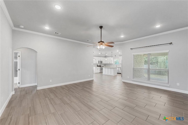 3305 Crystal Ann Dr, Temple, TX 76502 - unfurnished living room with a ceiling fan, arched walkways, ornamental molding, and recessed lighting