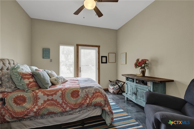 bedroom featuring ceiling fan and lofted ceiling